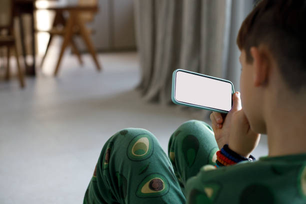 istock Teenager boy biting nails while using smartphone 1447205074