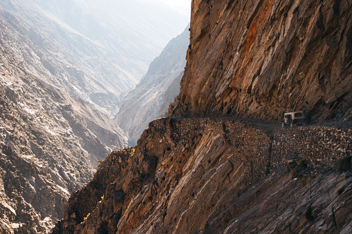 The off-road car riding on the extremely dangerous road in the Himalayas mountains