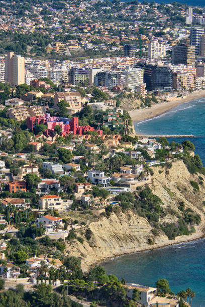 istock The Red Wall of Calpe between numerous buildings. 1447205752
