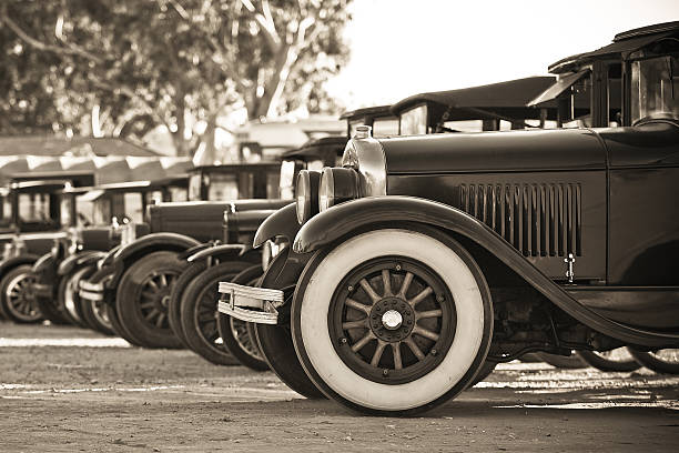 Old Car Line Up a line of old cars used in a movie shoot vintage car stock pictures, royalty-free photos & images