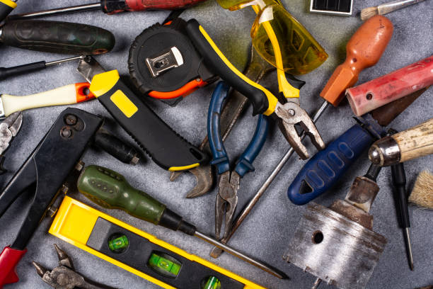 istock A set of hand tools on a concrete floor. 1447208258