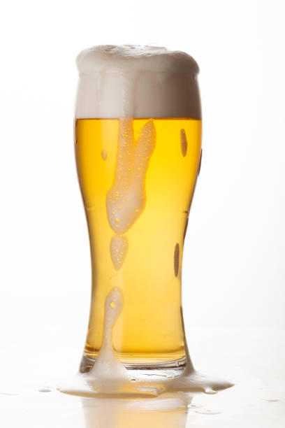 istock Glass of light beer isolated on white background 1447208600