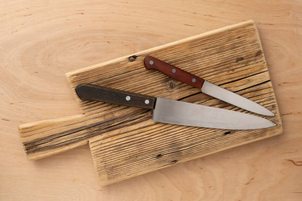 istock Cutting wooden board and kitchen knives 1447208799