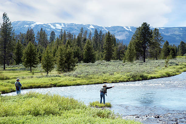 a bend in the Provo River in Utah with a couple of fisherman.