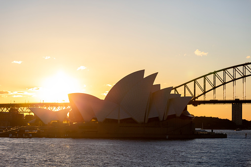 Sydney, Australia - August 13, 2016: Sydney Opera House and Harbour Bridge at sunset