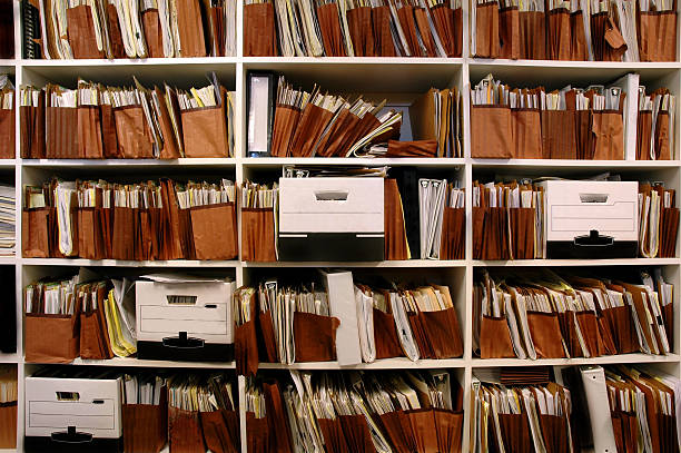 Files on Shelf Office shelves full of files and boxes stacking stock pictures, royalty-free photos & images