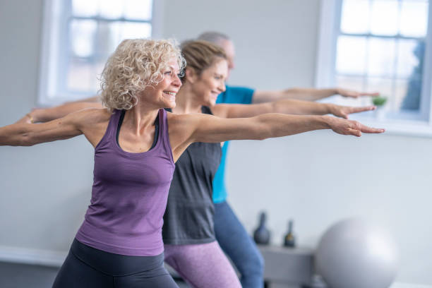 istock Women in a Yoga Class 1447212817