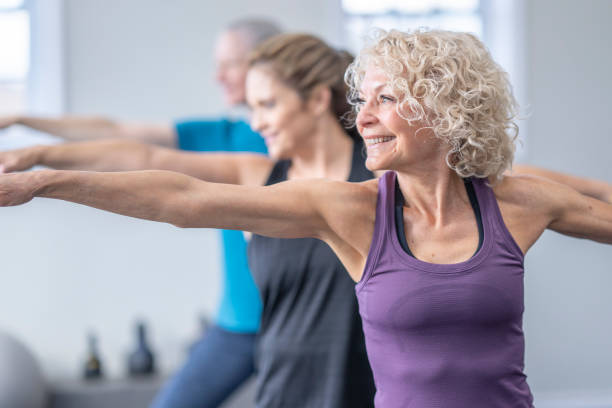 istock Women in a Yoga Class 1447212820