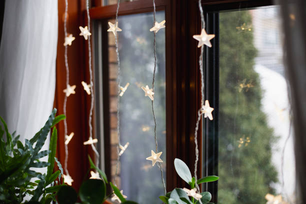 istock Christmas lights in a window 1447216633