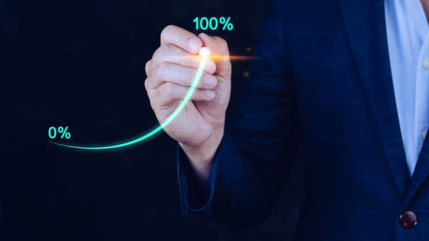 istock Businessman holding stylus pencil pointing touching to that has grown exponentially rapidly from 0 percent to 100 percent sales in short period of business success strategy and planning concept. 1447221233