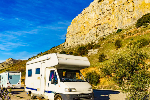 a motorhome parked near beautiful mountains