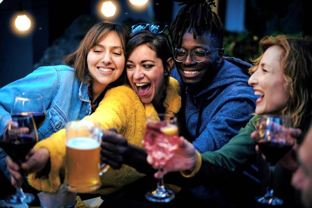 istock Young people friends having fun drinking beer and wine at pub 1447222940