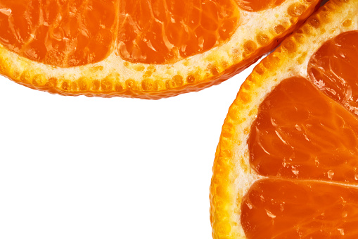 sliced sweet ripe tangerine close-up on a white background