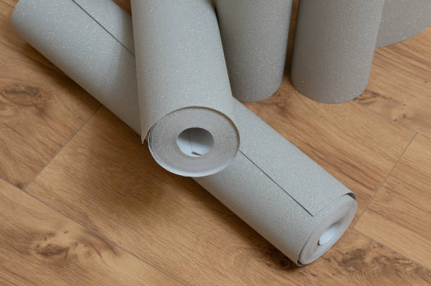 istock Preparing the wallpaper for the room 1447223205