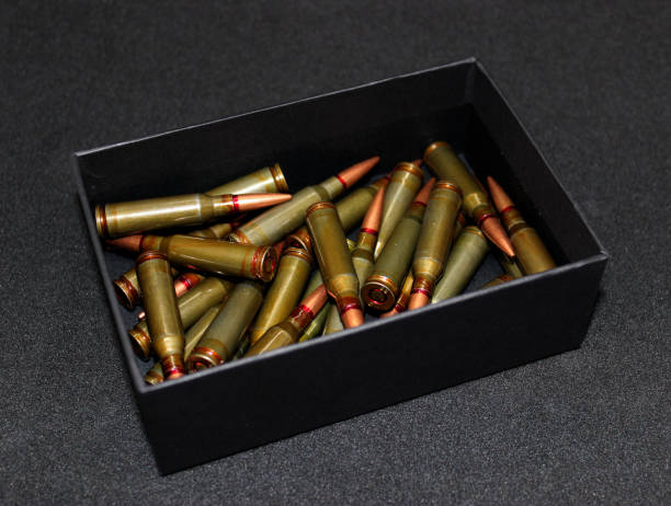 istock Unitary Cartridges In Black Box Scattered Isolated On Black Surface 1447225581