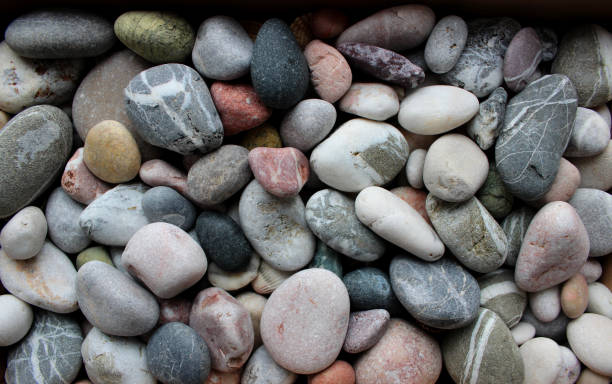 istock Colored Pebble Stones With Quartz Veins Texture Background Top View 1447229617