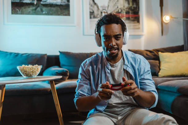 istock Leisure night at home and playing video games 1447230126