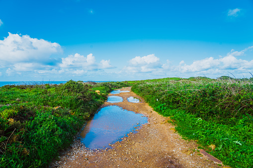 Tracking path among picturesque knolls leading