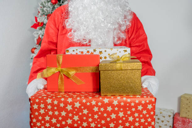 istock Santa Claus with Christmas presents 1447231414