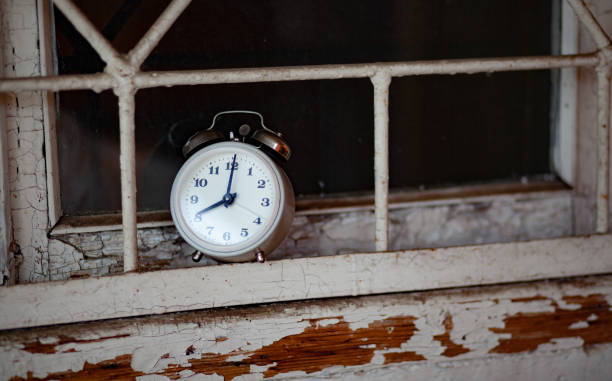 istock Old alarm clock on the windowsill 1447233278
