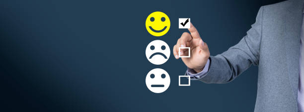 istock A businessman clicks on a smiley for quality evaluation 1447233280