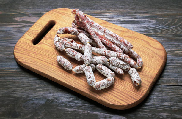 istock Salami sausages on a wood 1447235893