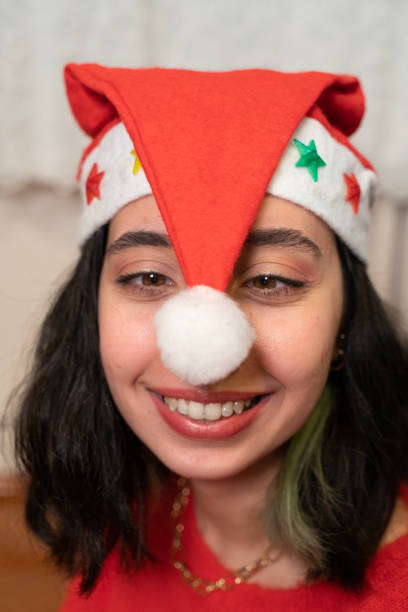 Woman decorating very happily Christmas tree and decorated Christmas tree. decorating christmas tree at home