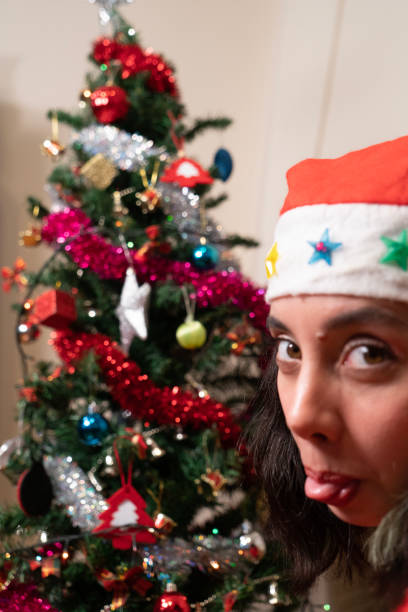 istock young woman decorates the new year tree 1447236108