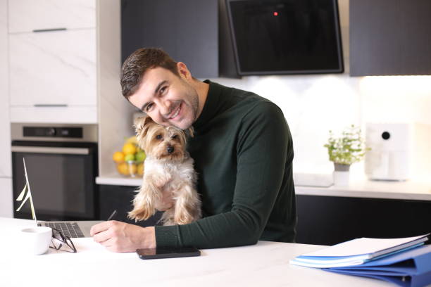 istock Man working from home with his dog 1447243068