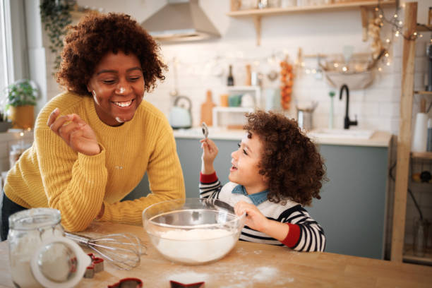 istock Mother and son having fun in kitchen 1447243674