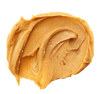 Peanut butter spread on white background