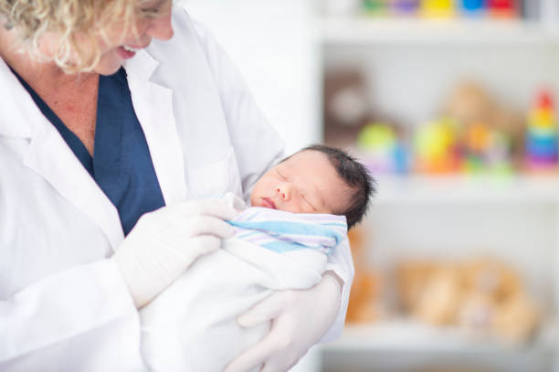 istock Pediatrician with a Newborn 1447247957