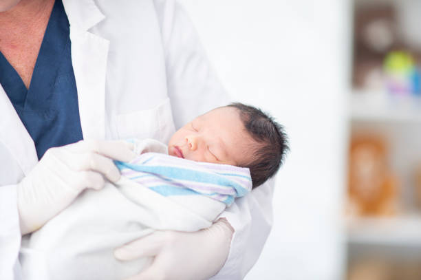 istock Pediatrician with a Newborn 1447247959