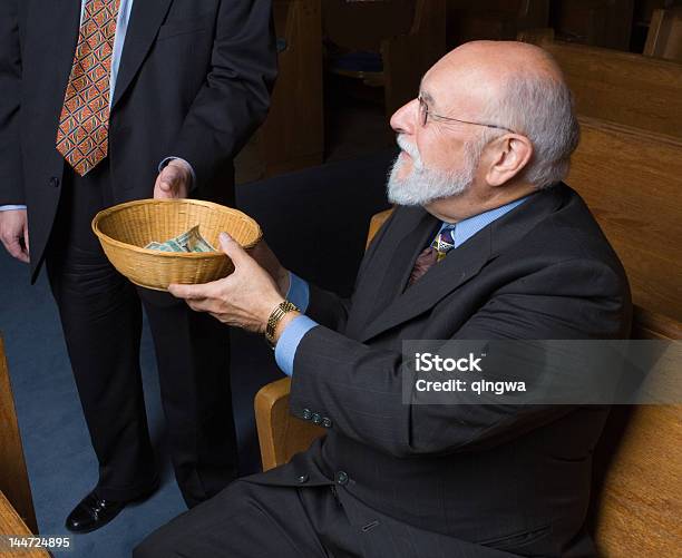 Senior Caucasian Man Handing Church Offering Basket To Usher Stock Photo - Download Image Now