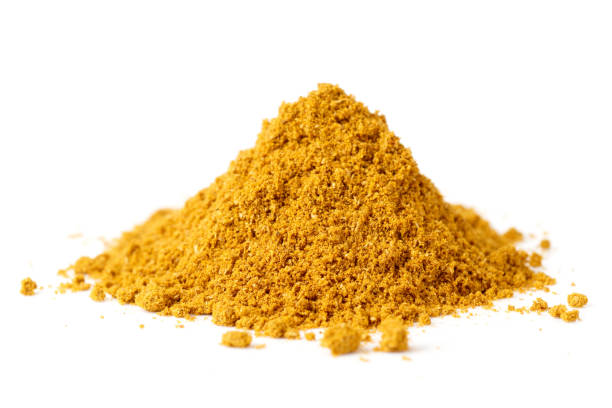 istock Pile of curry powder isolated on white 1447249009