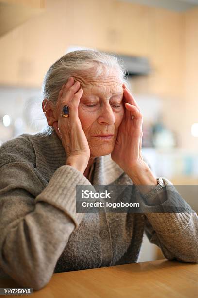 Senior Lady With Head In Hands Eyes Closed Stock Photo - Download Image Now - 70-79 Years, 80-89 Years, Adult