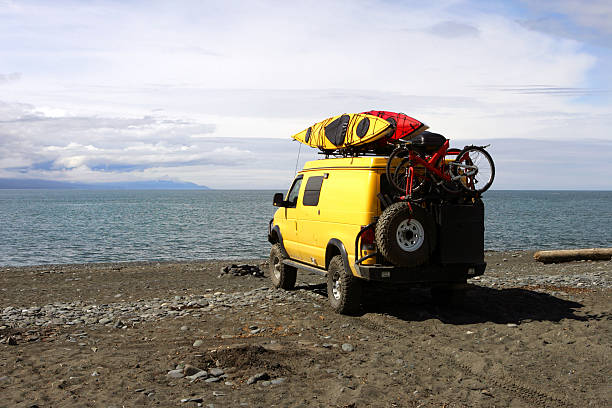 group of Wazik UAZ-452, the 4WD Russian Minibus waiting for tourist on the ice road of the frozen Lake Baikal in winter.