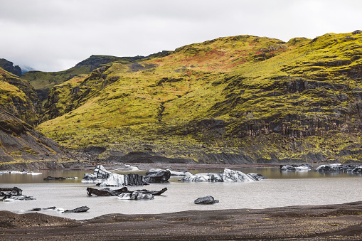A 4x4 vehicle crosses a river in Western Iceland