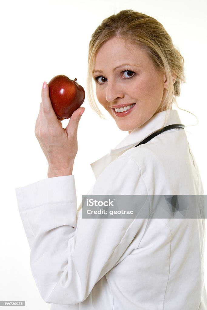 Zdrowe badanie - Zbiór zdjęć royalty-free (An Apple A Day Keeps The Doctor Away - powiedzenie angielskie)