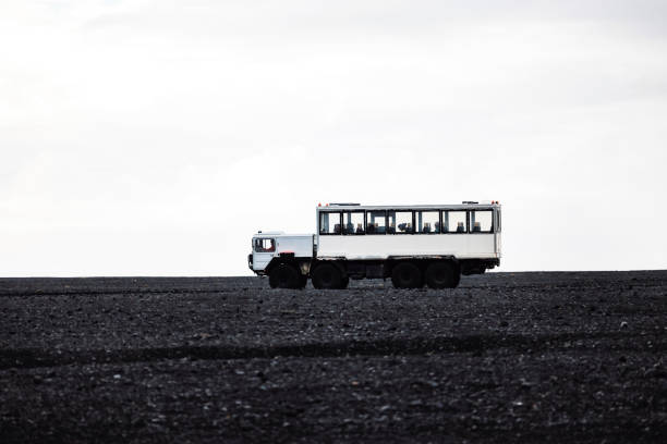 istock Car driving on the Selheimasandur black beach 1447261709