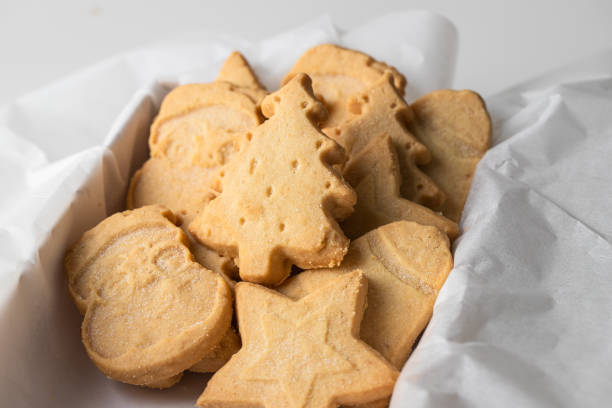 istock Festive shape shortbread cookies. Famous Scottish  biscuits into the white box. 1447262096