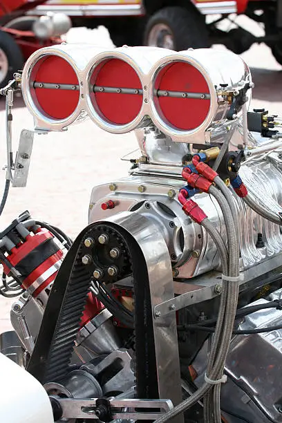A large supercharged engine in a tractor used in tractor pulls.