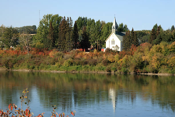 istock Autumn Church Reflection Landscape 144726478