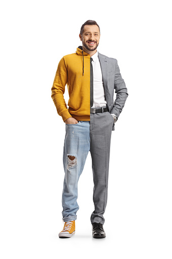 Young man wearing suit and tie on one half and jeans and hoodie on other half isolated on white background