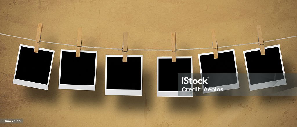 Photos Photos on a leash and in front of a textured brown background. No People Stock Photo