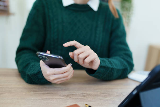 istock business owner or Asian male marketers are using smart phone and tablet computer in office work 1447269090