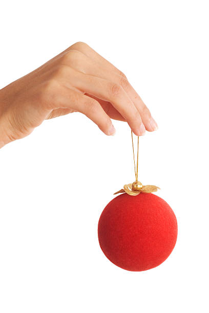 istock hand holding red christmas ball 144727702