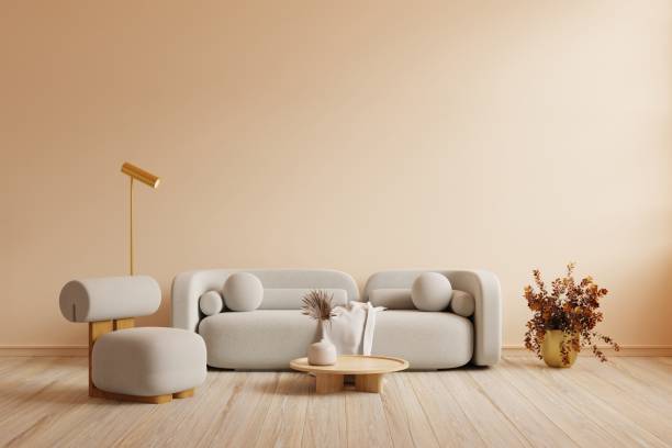 istock Boho style interior with gray sofa and armchair on cream color wall. 1447284929