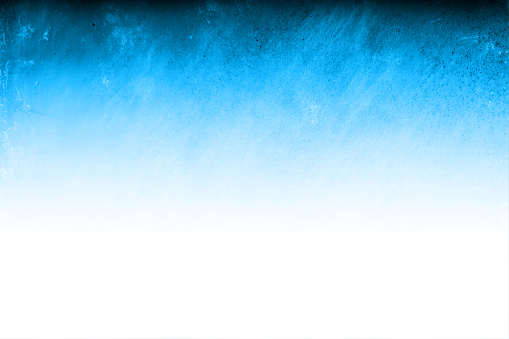 A horizontal vector illustration of gradient textured bright blue and white coloured backdrop, Smudges and faint scratches all over with ample copy space, no people and no text. Can be used as wallpapers, textured tiles templates and designs.