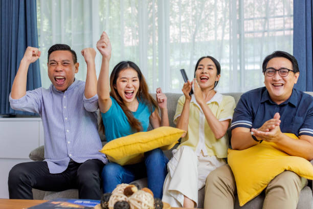 istock Friends enjoy watching media at home together. 1447288617